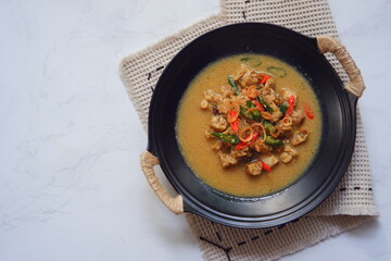 a bowl of tempeh cooked in coconut milk and spices named jangan ndeso in Bahasa