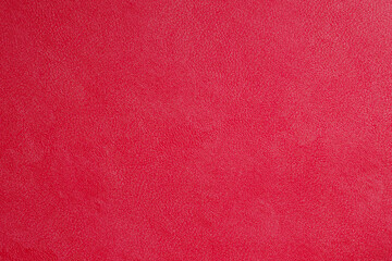 Red fine texture of genuine leather. Natural expensive products