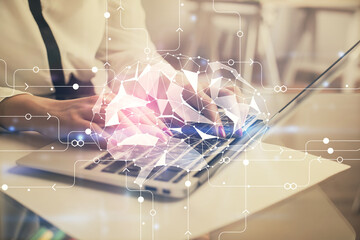 Multi exposure of woman hands working on computer and human brain hologram drawing. Ai tech concept.