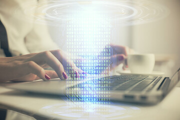 Multi exposure of woman hands working on computer and data theme hologram drawing. Tech concept.