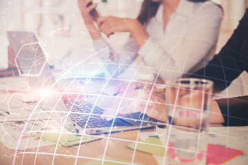 Double exposure of woman hands working on computer and world map hologram drawing. International technology business concept.