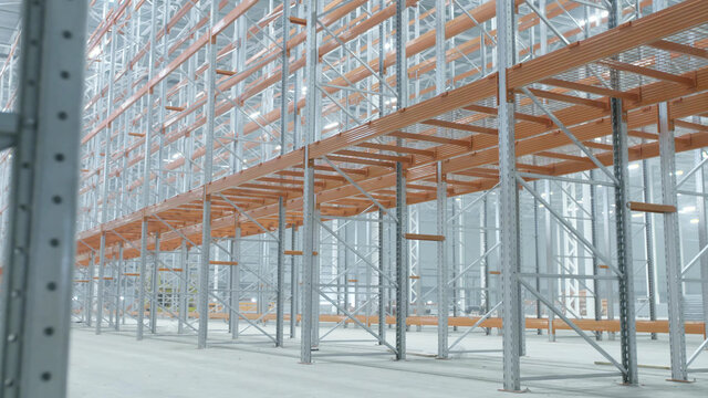 New distribution warehouse hall with empty metal shelves