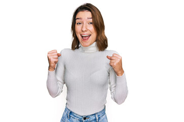 Young caucasian girl wearing casual clothes celebrating surprised and amazed for success with arms raised and open eyes. winner concept.