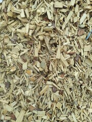 Biofuel chips. A pile of wood chips for heating industrial boilers close-up. Background and texture