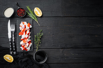 Fresh Crab meat surimi with blue swimming crab, on black wooden table background, top view flat lay  , with copyspace  and space for text