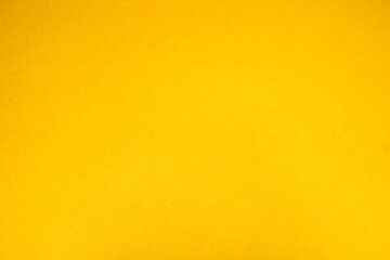 Yellow background. The texture of the cardboard.