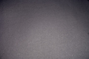 Black background. The texture of the cardboard.