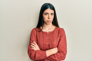 Young hispanic woman wearing casual clothes depressed and worry for distress, crying angry and afraid. sad expression.