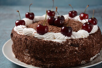 Black forest cake, Schwarzwald pie, dark chocolate and cherry dessert . Black forest cake decorated with whipped cream and cherries.