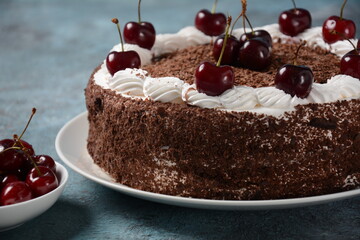 Black forest cake, Schwarzwald pie, dark chocolate and cherry dessert . Black forest cake decorated with whipped cream and cherries.