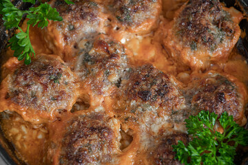 baked meatballs with cheese and tomato sauce