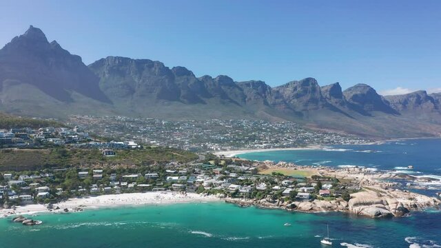 Aerial view. Shoreline of Camps Bay, Cape Town, South Africa, with Twelve Apostles mountains. CAPE TOWN, SOUTH AFRICA.