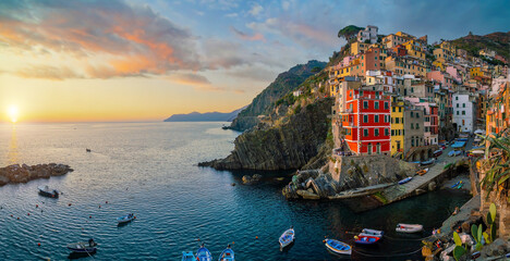 Riomaggiore,  Colorful cityscape on the mountains over Mediterranean sea in Cinque Terre Italy