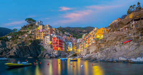 Fototapeta premium Riomaggiore, Colorful cityscape on the mountains over Mediterranean sea in Cinque Terre Italy