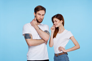 young couple in white t-shirt fashion modern style blue background