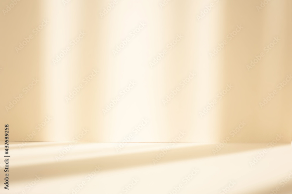 Aufkleber Abstract pastel yellow studio background for product presentation. Empty room with shadows of window. Display product with blurred backdrop.
