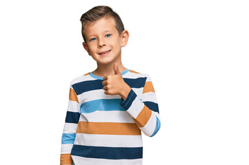 Adorable caucasian kid wearing casual clothes smiling happy and positive, thumb up doing excellent and approval sign