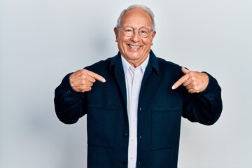 Senior man with grey hair wearing casual style and glasses looking confident with smile on face, pointing oneself with fingers proud and happy.