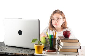 The girl at the videoconference. Girl talking through a laptop. Girl study. Video consecration. The...