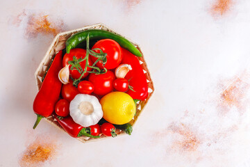 Assorted organic colorful vegetables in a basket.