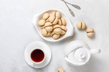 Baci di dama homemade italian hazelnut biscuits cookies with chocolate cream.