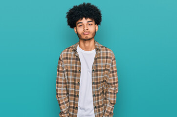 Young african american man with afro hair wearing casual clothes depressed and worry for distress, crying angry and afraid. sad expression.