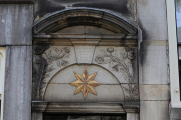 Amsterdam Keizersgracht Canal Building Carved Detail Depicting Flowers and a Golden Star