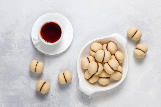 Baci di dama homemade italian hazelnut biscuits cookies with chocolate cream.