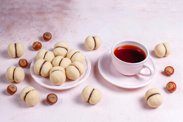 Baci di dama homemade italian hazelnut biscuits cookies with chocolate cream.