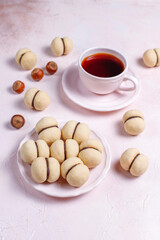 Baci di dama homemade italian hazelnut biscuits cookies with chocolate cream.