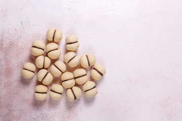 Baci di dama homemade italian hazelnut biscuits cookies with chocolate cream.