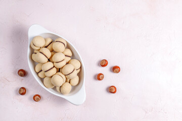 Baci di dama homemade italian hazelnut biscuits cookies with chocolate cream.