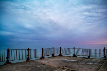 Beautiful sunrise on the old sea pier