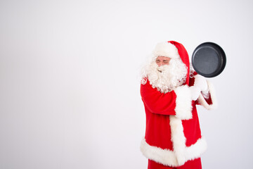 Funny Santa Claus with a frying pan.
