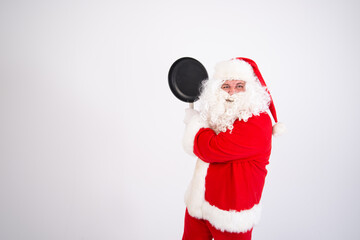 Funny Santa Claus with a frying pan.