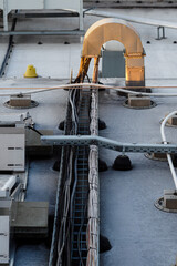 Cable tray on the roof for solar panels with an arched outlet.