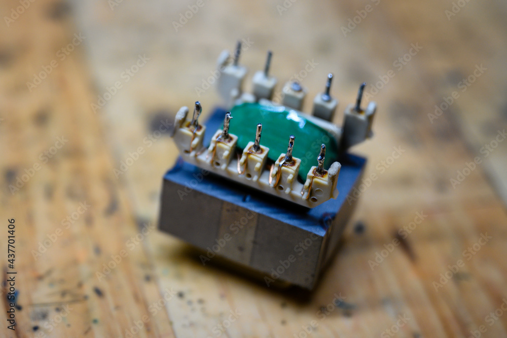 Sticker Small power transformer with spikes.