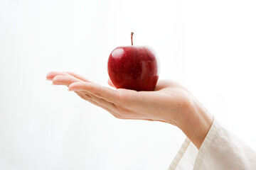 Woman Holding Apple. Fruit in Young Girl Hand, White Background.
