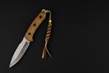 Tourist knife, on a black background