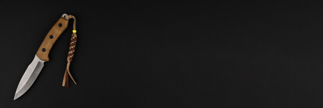 Tourist knife, on a black background