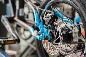Fototapeta na wymiar Disc brake on folding bike , Bicycle Maintenance and Repair concept