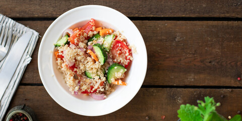 couscous salad tomato, cucumber, spices vegetable appetizer fresh portion organic on the table healthy meal snack copy space food background rustic top view 