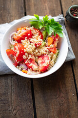 couscous salad tomato, cucumber, spices vegetable appetizer fresh portion organic on the table...