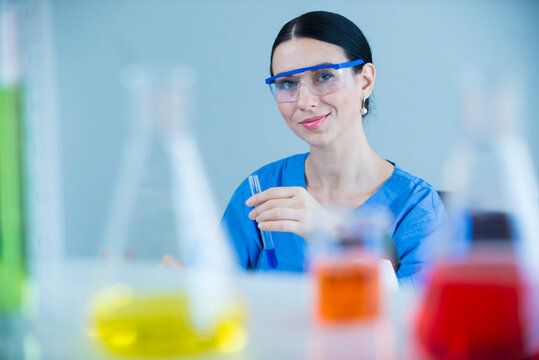 scientist in laboratory. portrait of a female researcher carrying out research in a chemistry lab.