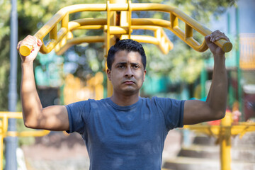 Mexican man training on a playground