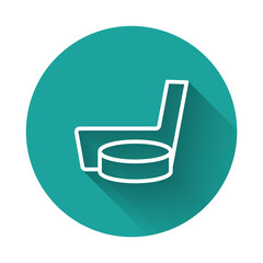 White line Ice hockey stick and puck icon isolated with long shadow background. Green circle button. Vector