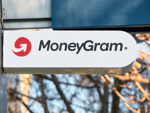 Bucharest, Romania - 01.01.2021: MoneyGram money transfer sign and logo mounted above the entrance of a branch in Bucharest.