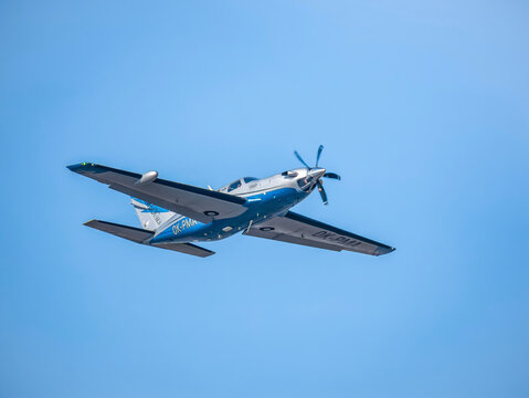 Otopeni, Romania - 01.23.2021: Light aircraft Piper PA-46-600TP (M600), belonging to OK Aviation Group, flying against blue sky