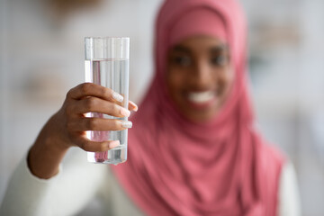 Healthy Liquid. Smiling Woman In Hijab Offering Glass With Water At Camera
