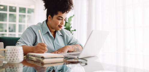 Businesswoman looking busy working from home